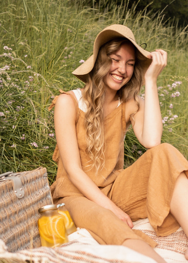 Tan linen jumpsuit for picnics, garden parties. Adjustable ties and side pockets